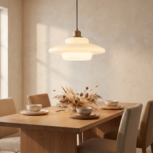 Milane pendant light above an oak dining table at dusk