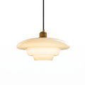 Milane white opal glass mid century pendant light with brass collar on a white background