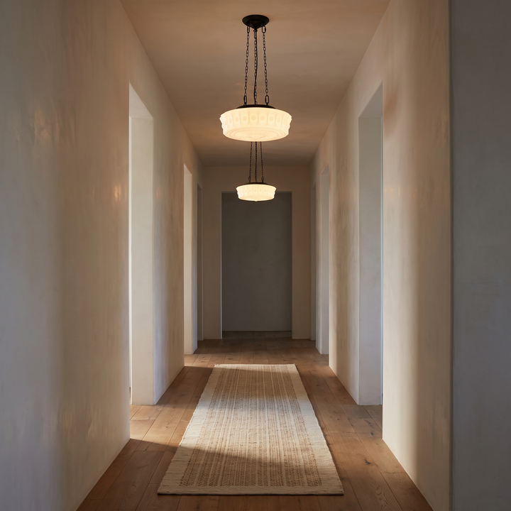 Two Belara opal dome pendants down a hallway at dusk