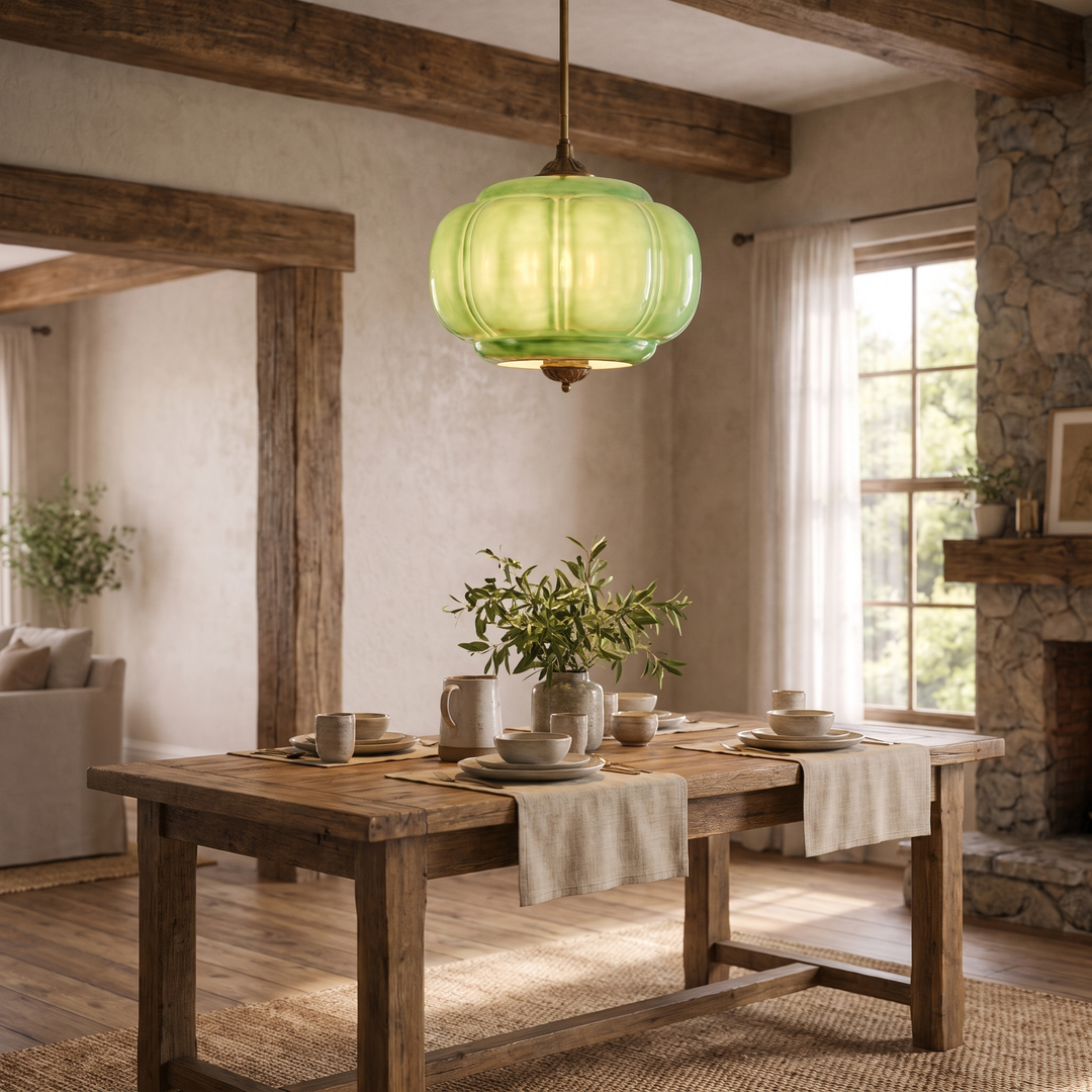 A Verella green glass pendant over a dining table